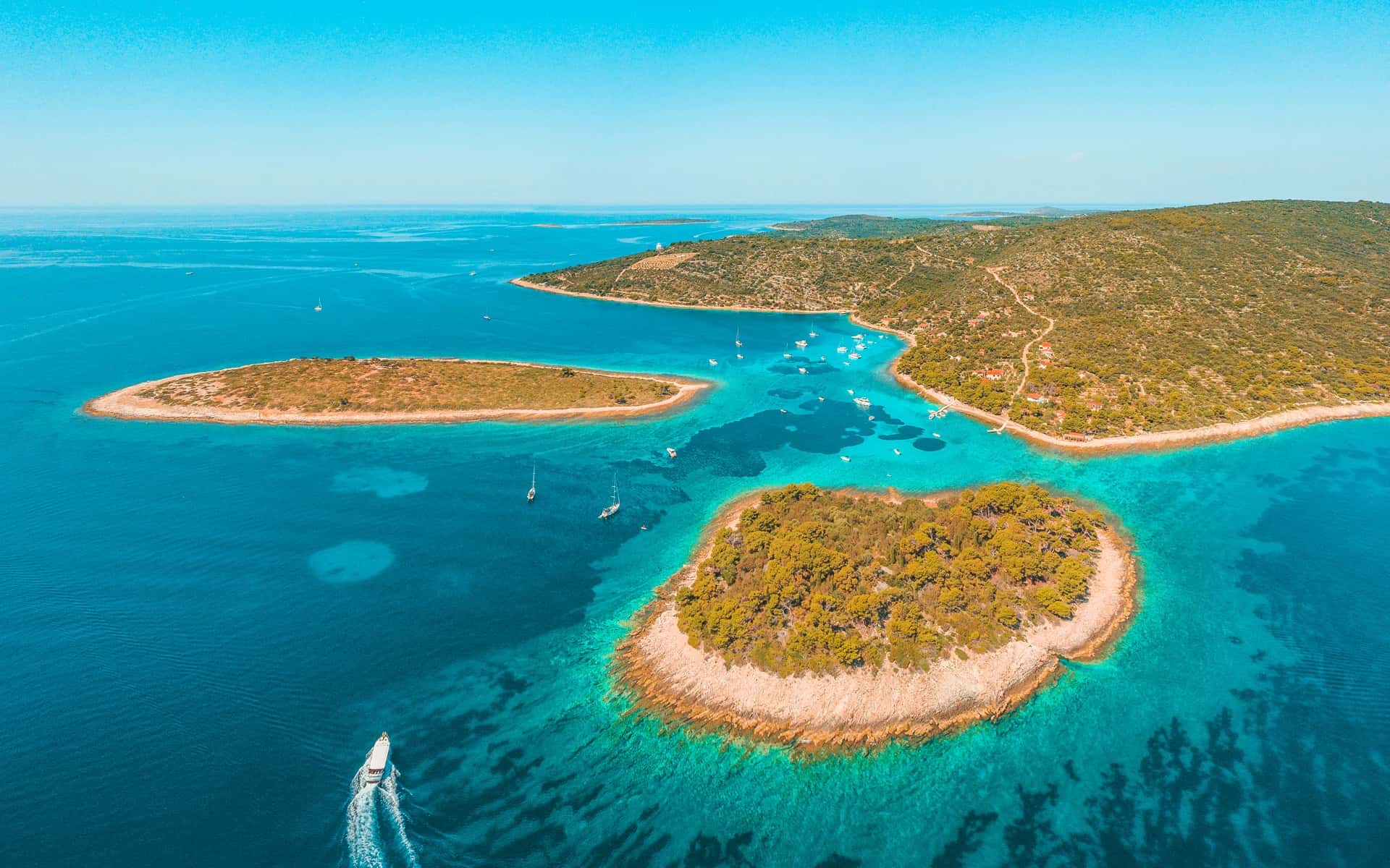 Turquoise lagoon and pine-fringed islets near Drvenik