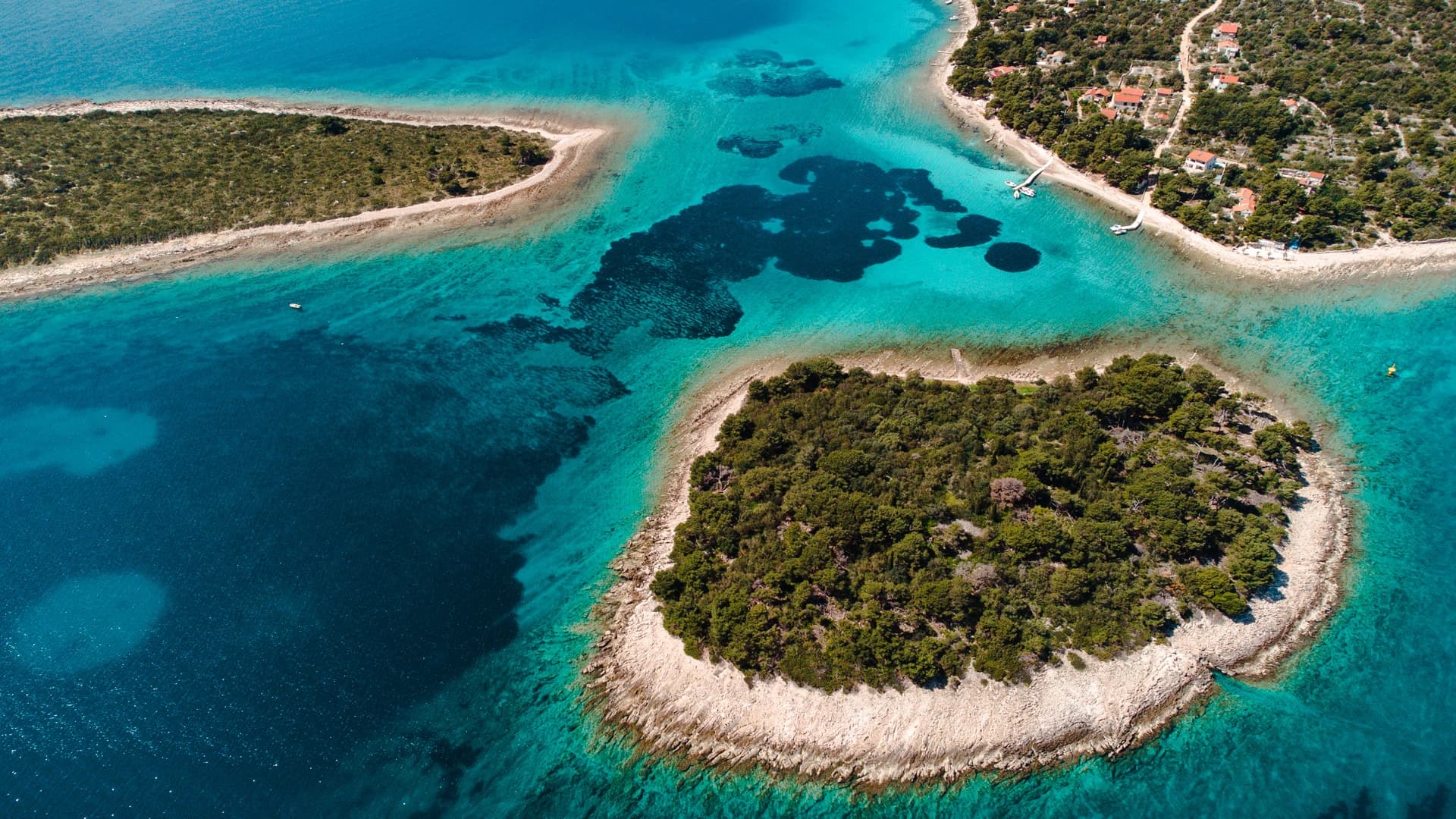The Blue Lagoon's clear turquoise shallows from above