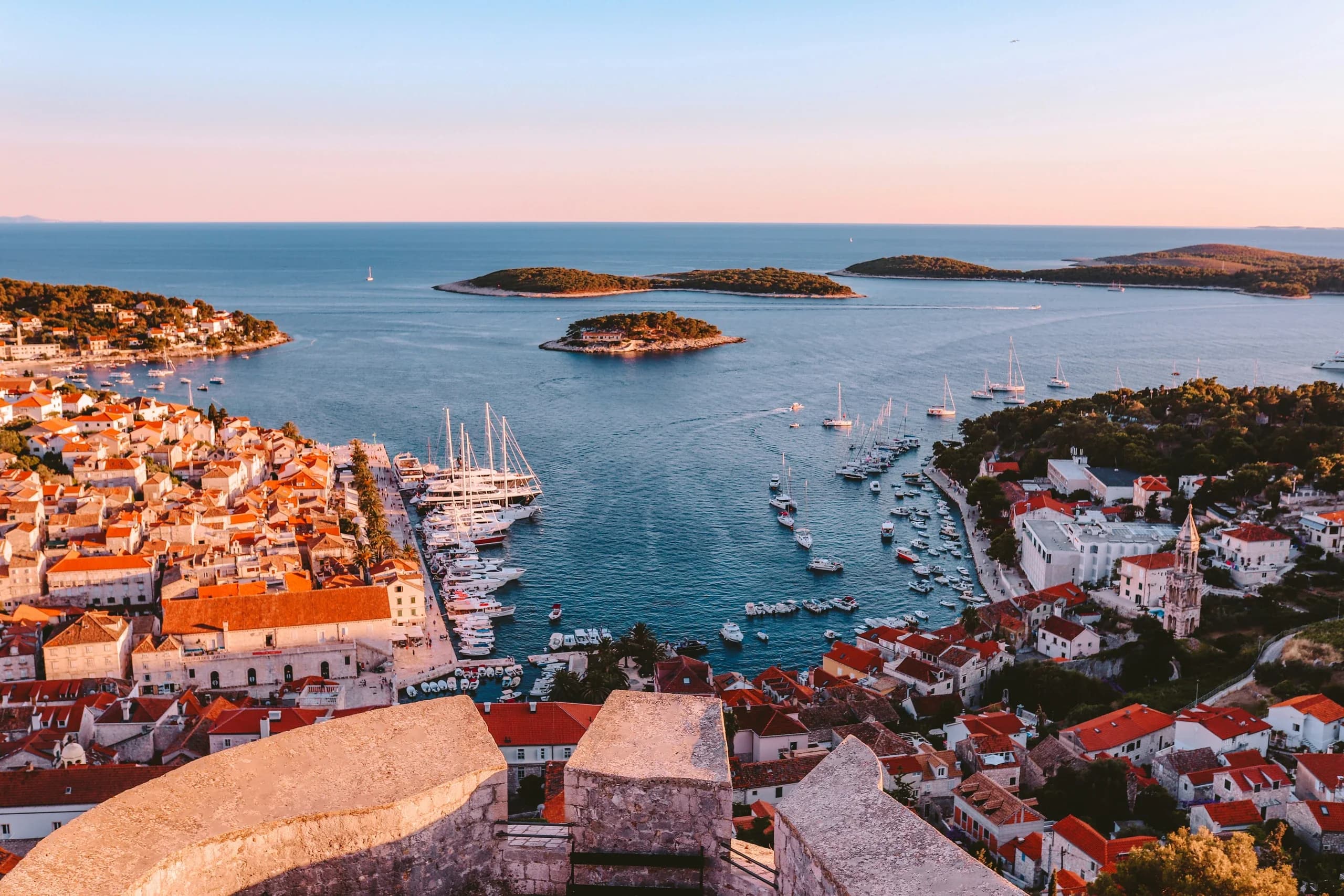 Golden-hour view of Hvar Town harbour and the Pakleni Islands