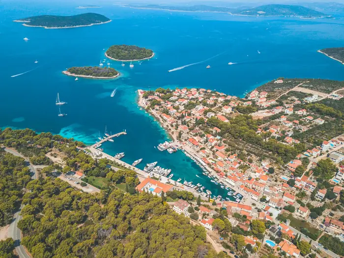 Guests relaxing on the bow of a speedboat on a calm sea