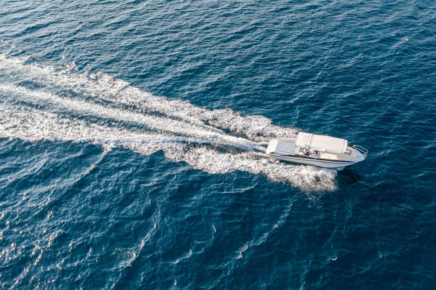 SeaExplore speedboat cutting across the deep-blue Adriatic, seen from above