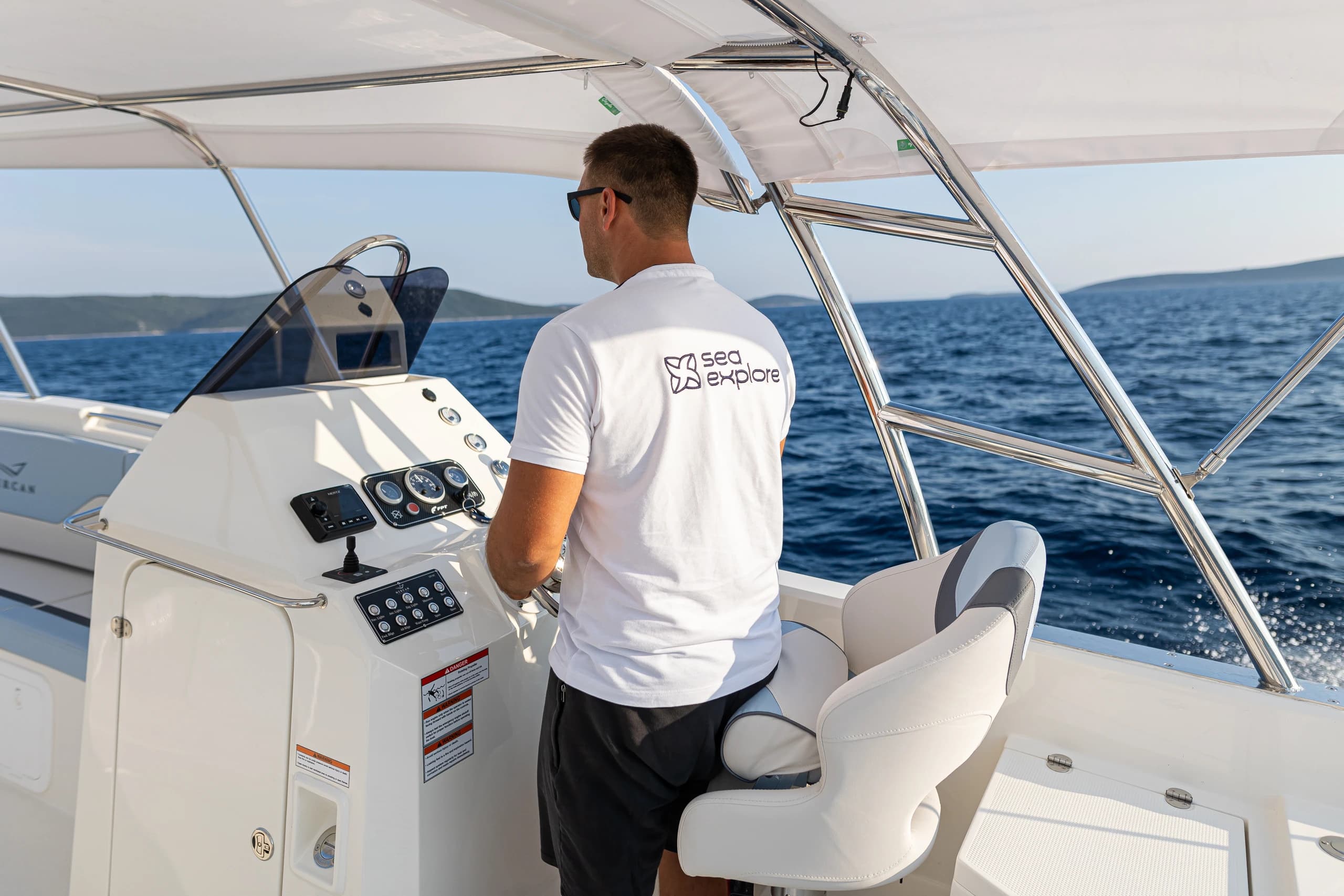 SeaExplore skipper at the helm of the speedboat